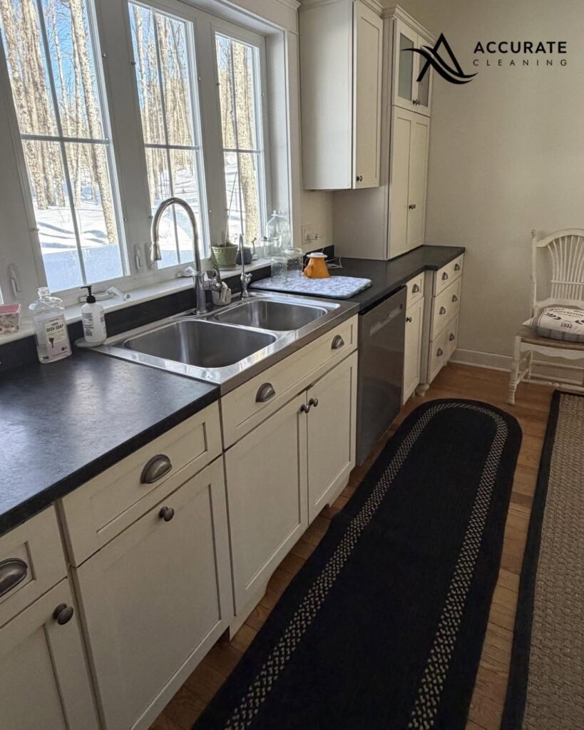 Clean kitchen sink and dark countertops