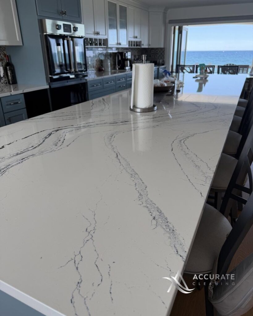 Polished marble kitchen island cleaned by Accurate Cleaning