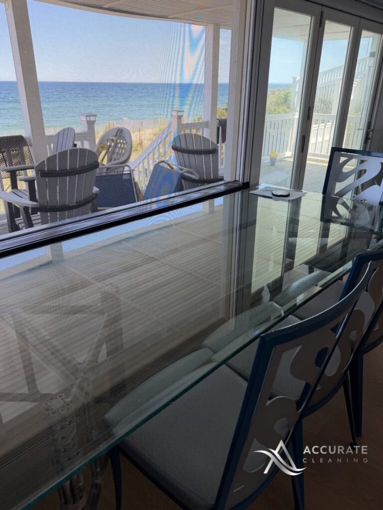 Spotless glass dining table facing the ocean